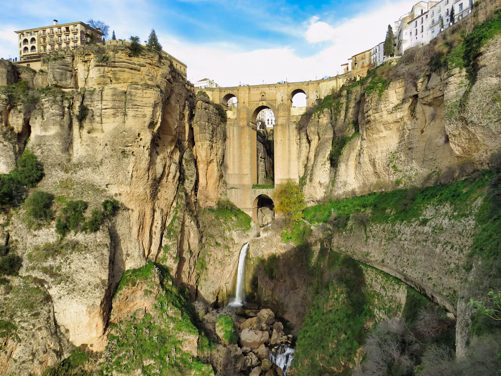 The Puente Nuevo bridge across the gorge at Ronda, with a waterfall below