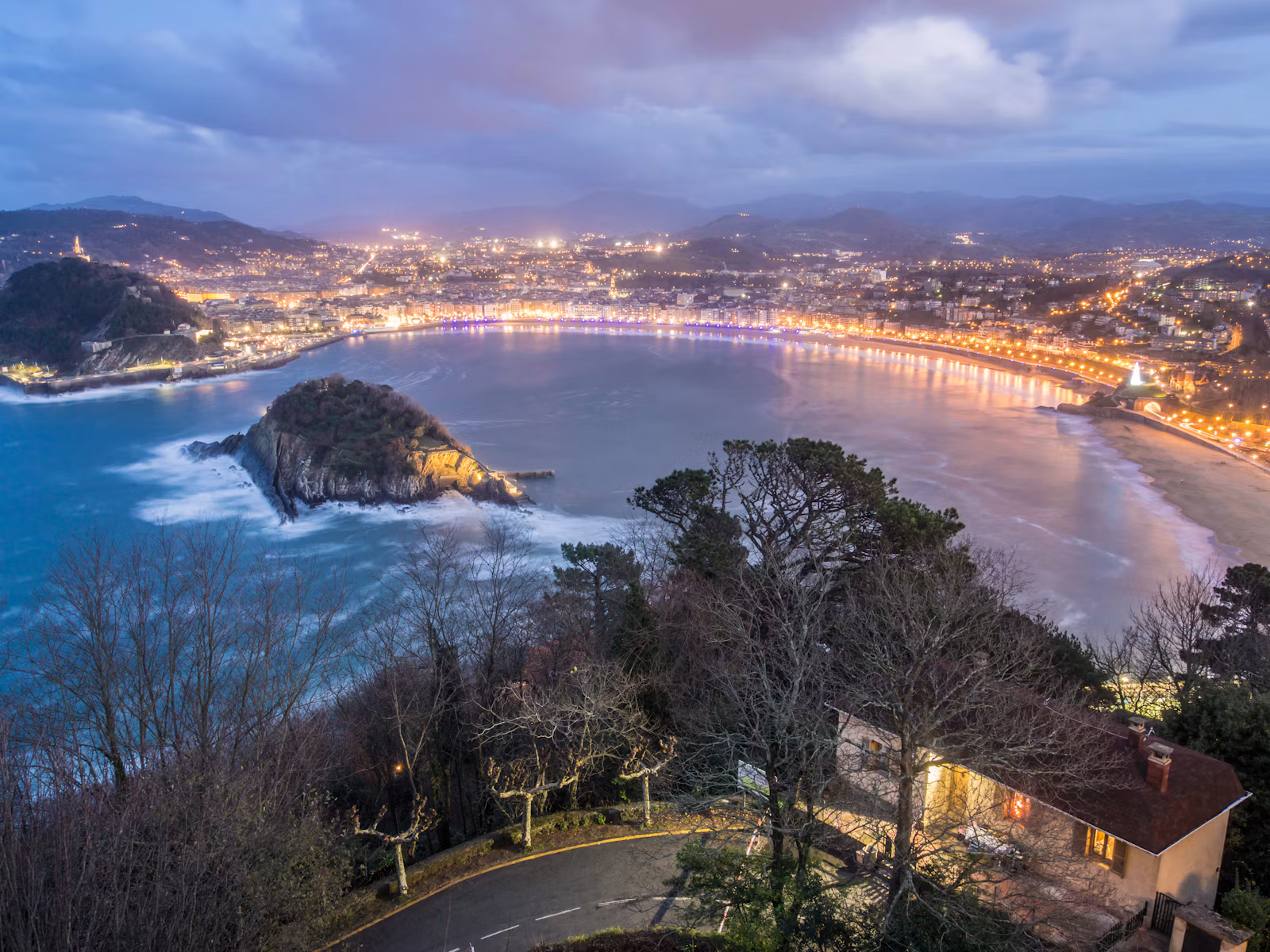 La Concha bay and San Sebastián at dusk, seen from above